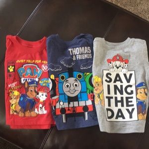 Two Paw Patrol and one Thomas Train T-shirt.
